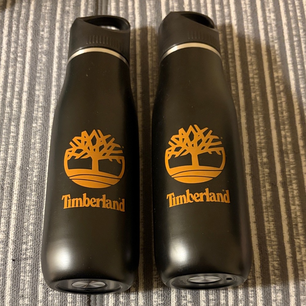 Timberland Black and Orange Logo Water Bottles, Never used.